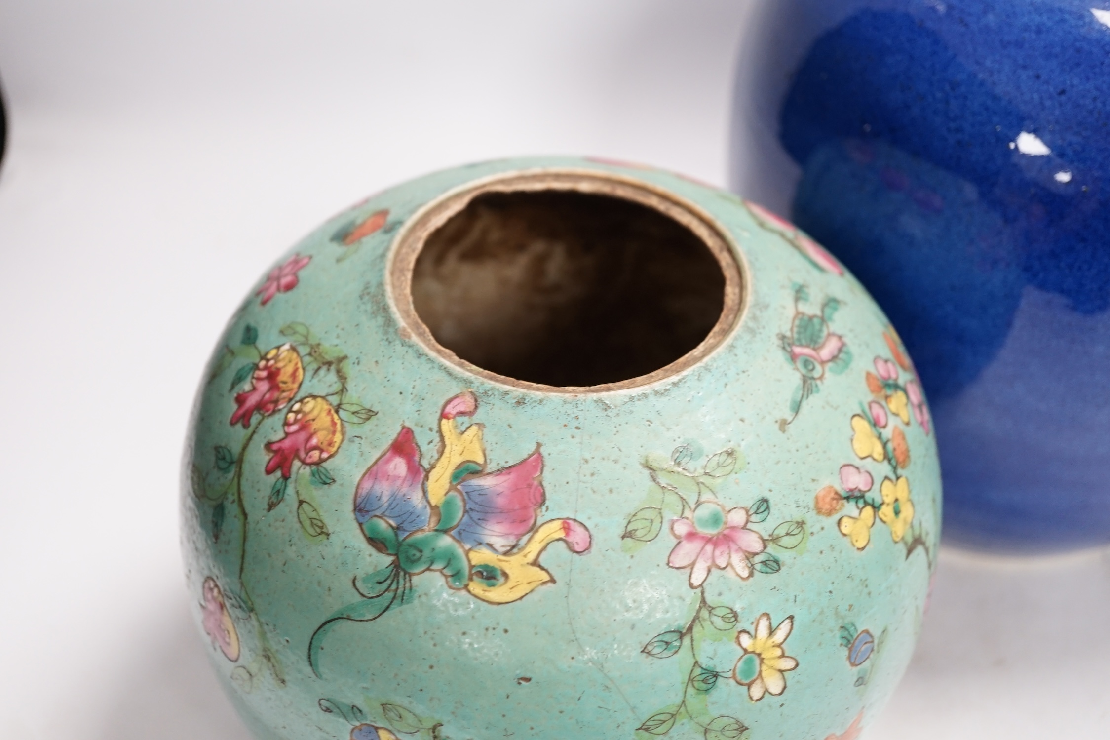 A Chinese powder blue jar, late 19th century, drilled hole to base and a turquoise glazed ground jar, blue vase 22cm high. Condition - turquoise jar cracked and chipped